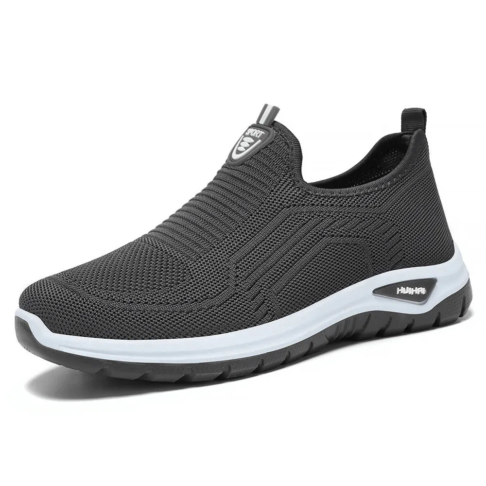 Men's black and grey breathable casual tennis shoes with mesh upper and round toe.