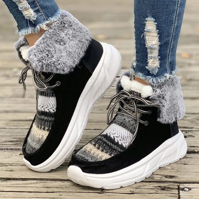 Beige women's lace-up mid-top snow boots with a fuzzy lining and thick platform sole.