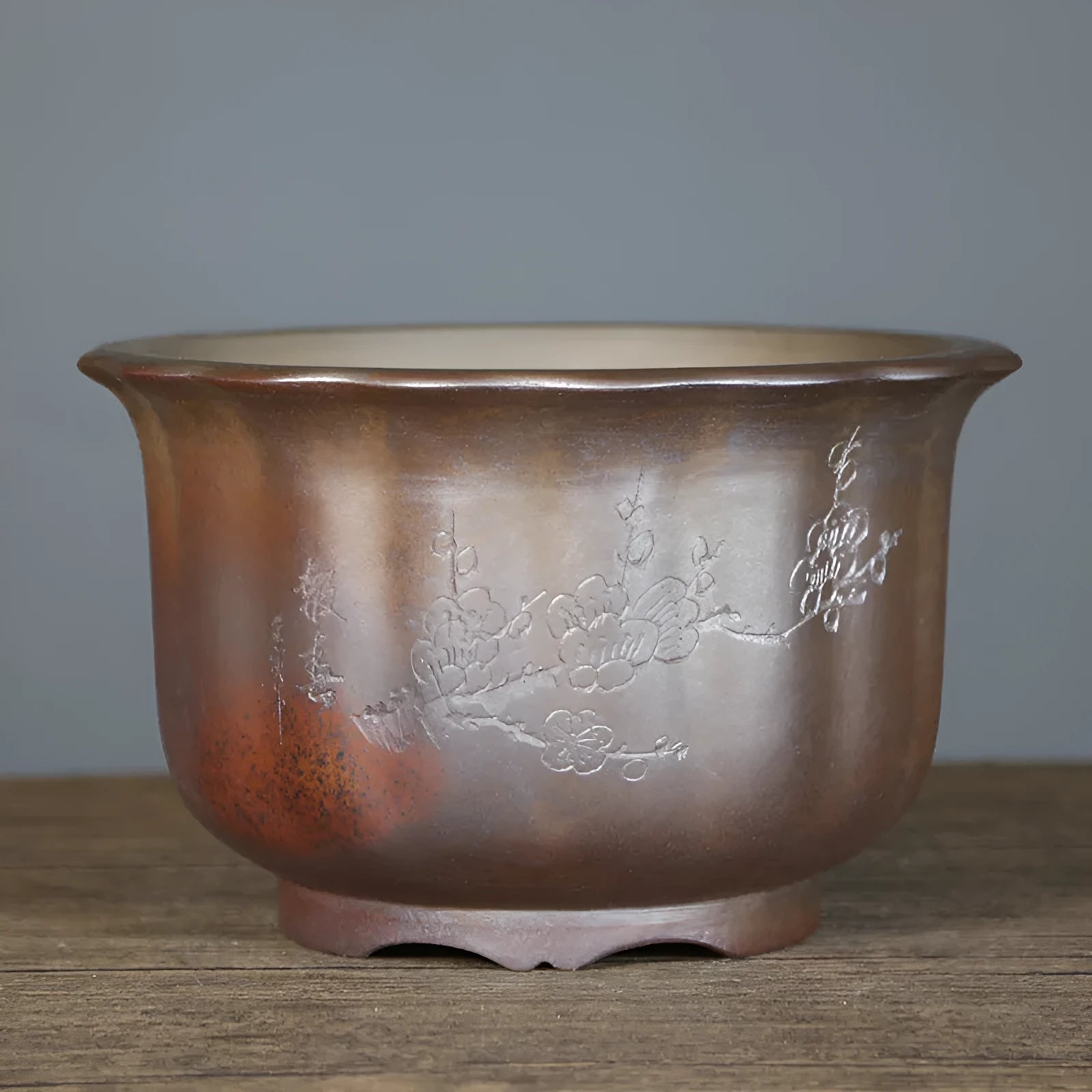 Antique carved purple sand ceramic bonsai pot in classical design for indoor plants.