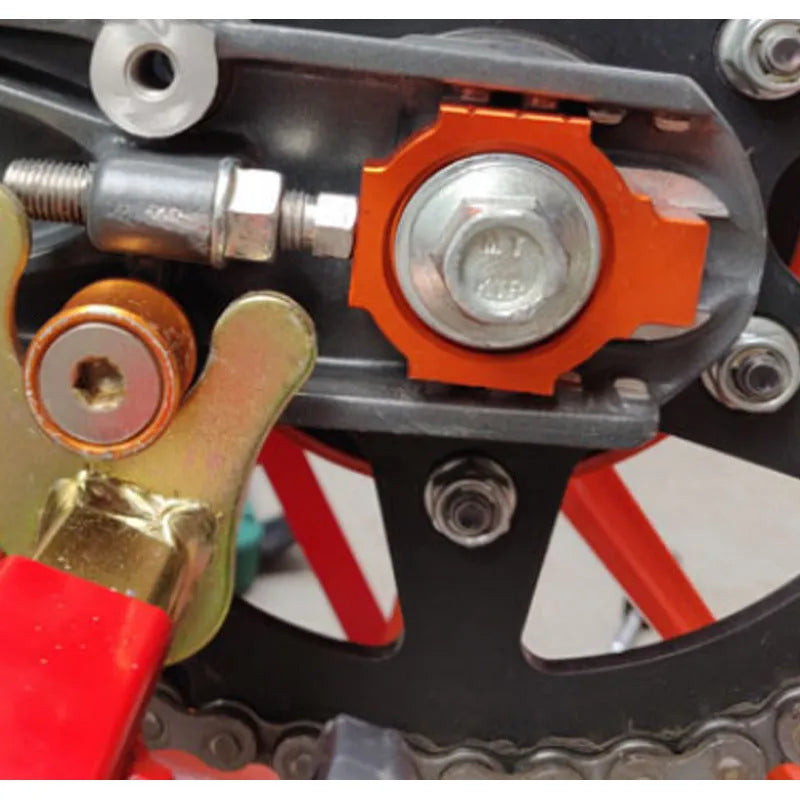 Orange anodised aluminium adjuster screws for KTM DUKE motorcycle rear forks