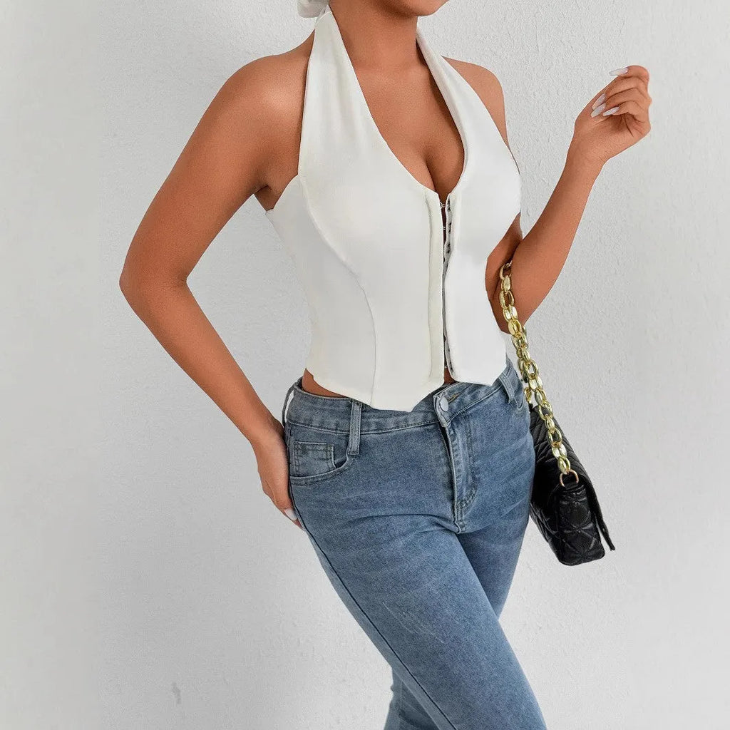 White sleeveless V-neck crop top with lace-up backless detail on woman against neutral background