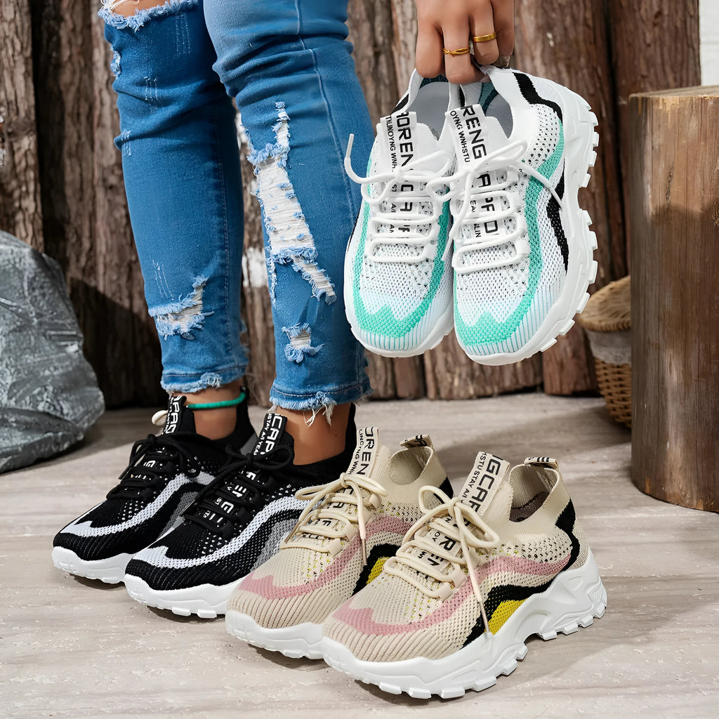 Women's casual sports shoes with mesh upper and PVC sole in black and white colour