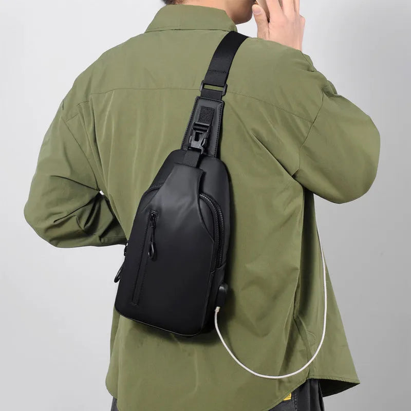 Black sling crossbody backpack for men with zip closure and soft handle, solid colour