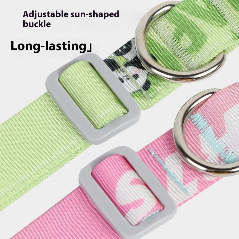 Adjustable nylon dog collar with cartoon gradient print and metal D-ring on a green background.