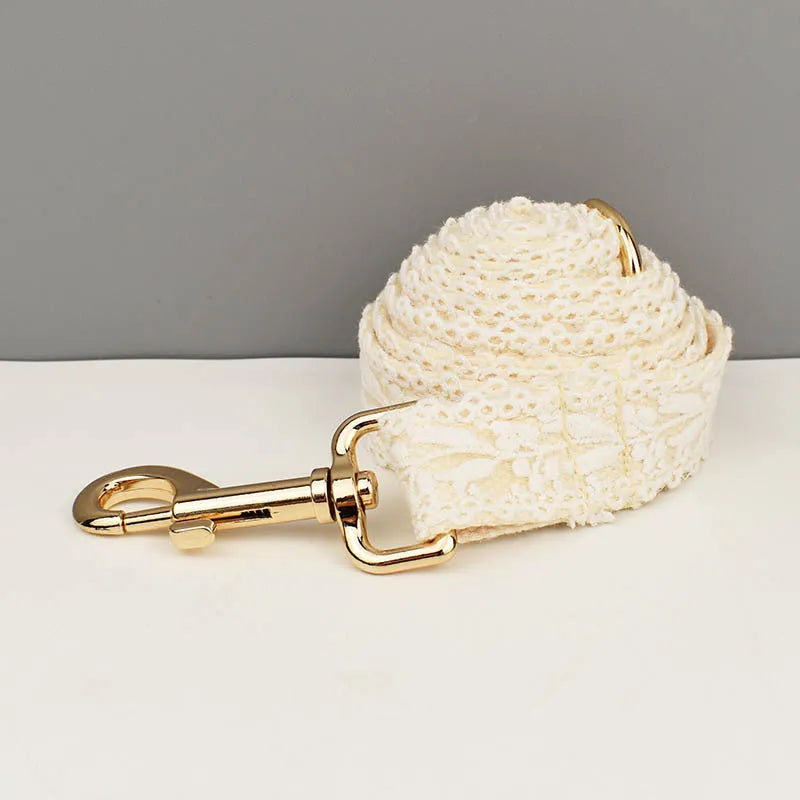 Leaves and lace pattern dog wedding collar and leash set with vest and floral accessories on a white background.