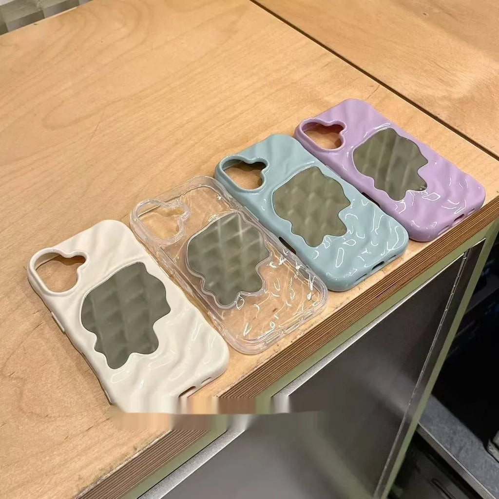 Solid colour iPhone case with water ripple texture and a small mirror, shown on a phone.