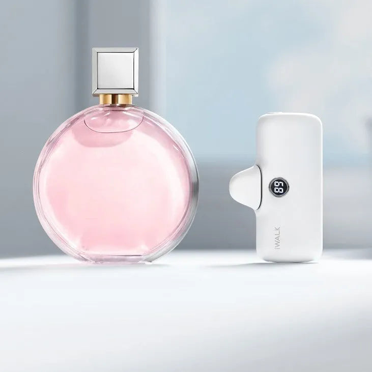 Compact cylindrical lipstick-shaped power bank showing digital battery percentage screen, in choice of colours.
