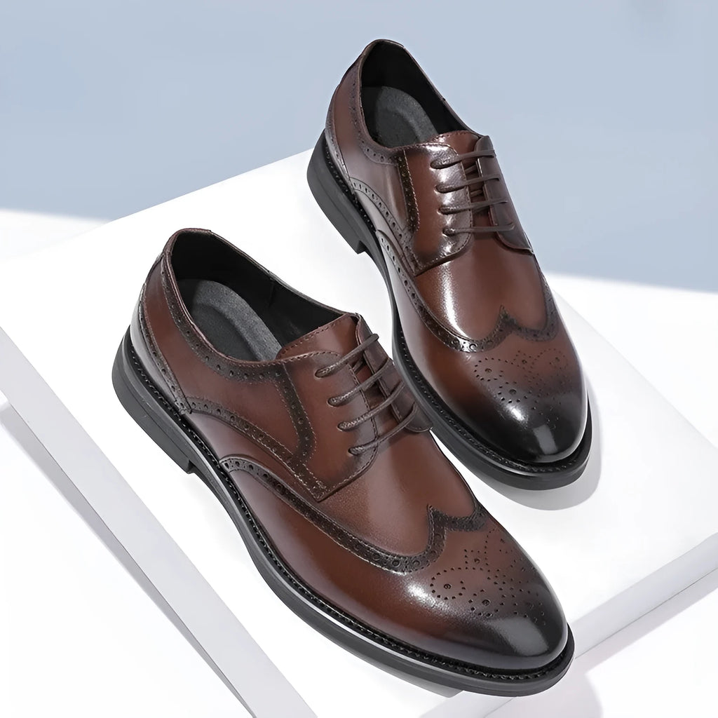 Men's black brogue formal shoes with a lace-up front and perforated detail.