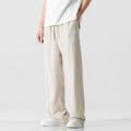 Men's beige linen-blend cropped trousers with a drawstring waist on a plain background.