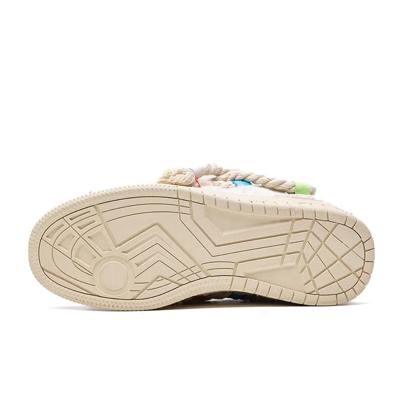 Creamy white Old Damage retro skate shoes with lace-up front and platform sole.