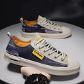 Men's round toe canvas shoes in dark blue with rubber sole and lace-up front