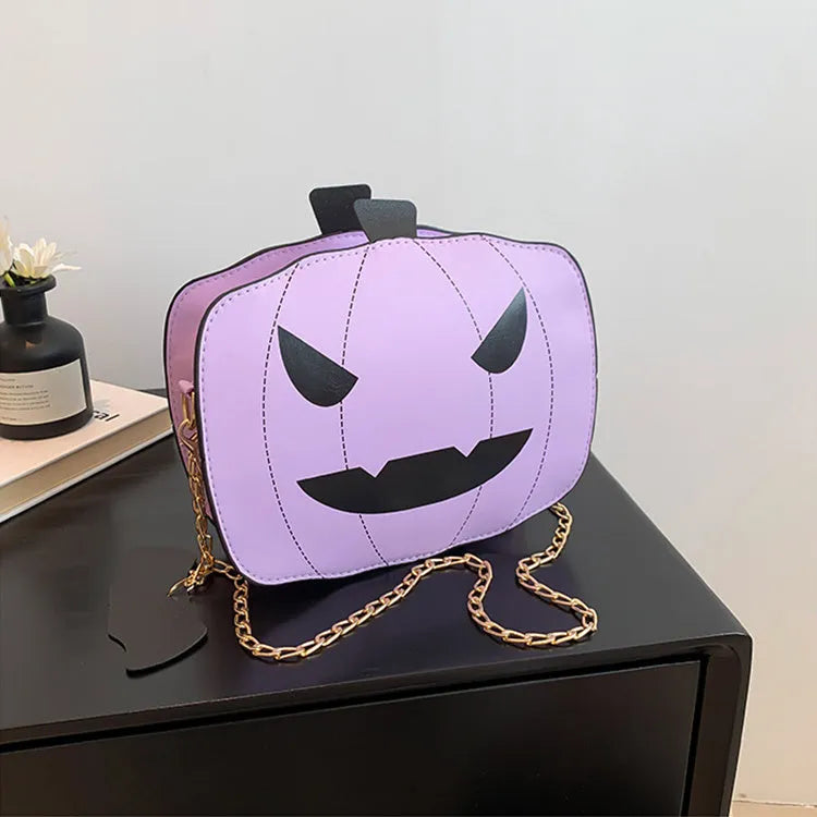 Halloween cartoon pumpkin shoulder bag for girls in colour options with chain crossbody strap on white background