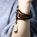 Traditional rosewood bead bracelet with 108 beads and a Hotian jade pendant.