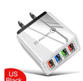 Simple Luminous compact 4-port USB wall charger with UK plug and blue luminous power indicator light on.