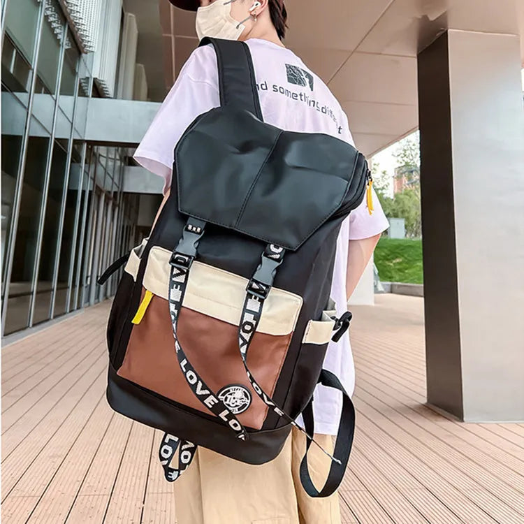 Oxford cloth backpack in black, green, or red, showing handheld and shoulder strap carry options