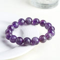 Feather amethyst crystal bracelet in Snow Mountain purple with scattered Ruyi geometry beads.