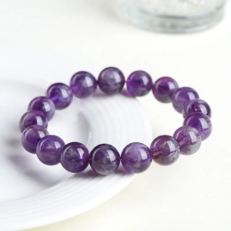 Feather amethyst crystal bracelet in Snow Mountain purple with scattered Ruyi geometry beads.