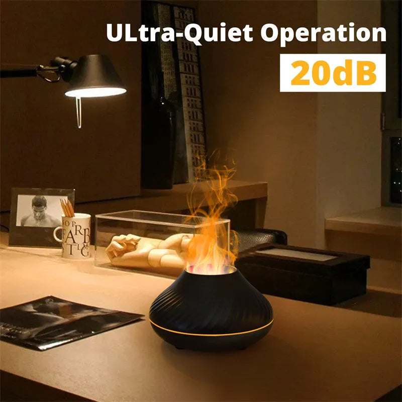 Beige volcanic flame aroma diffuser with LED light on a wooden table next to an essential oil bottle
