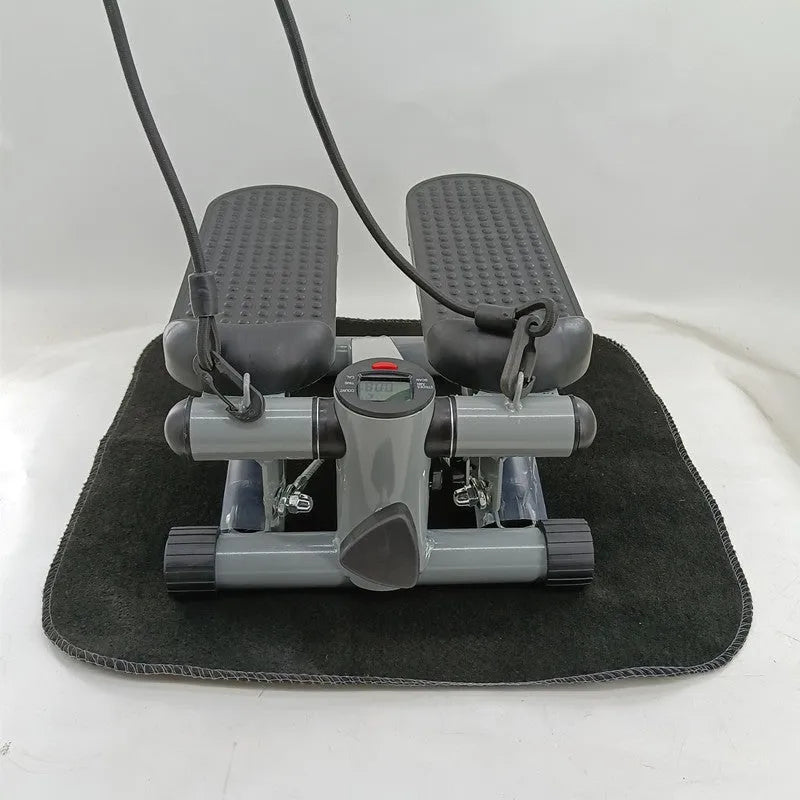 Silver grey hydraulic mini treadmill for home waist slimming fitness.