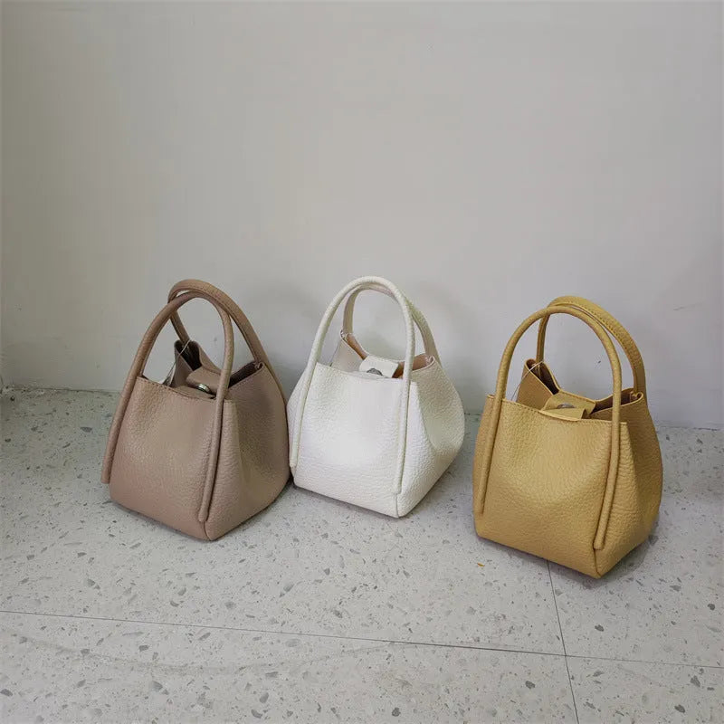 Retro portable casual crossbody women's bag in soft PU, bucket shape, 19cm length, available in seven colours.