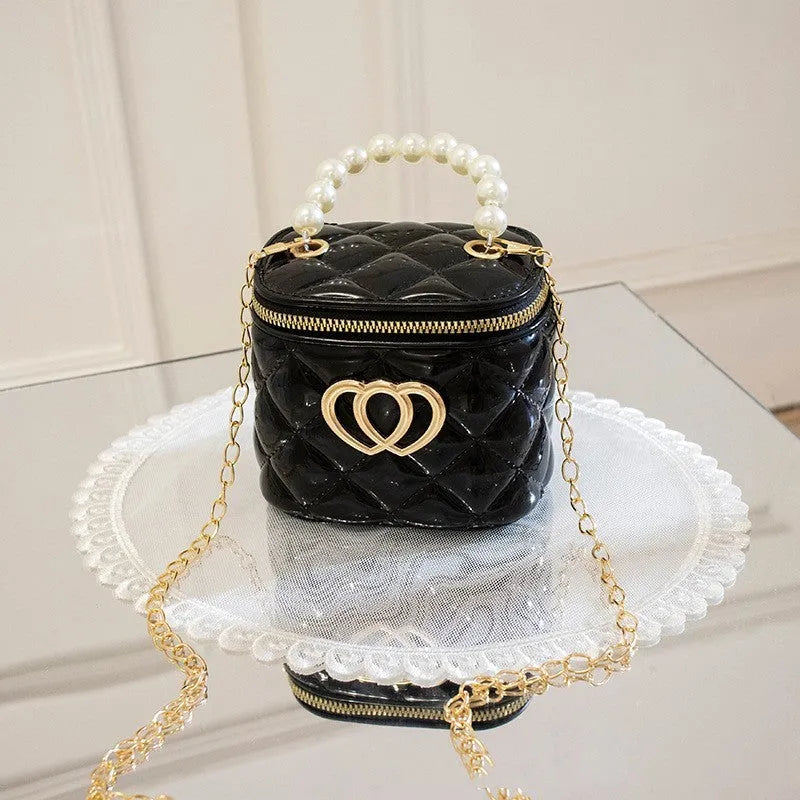 PVC bucket-shaped gel bag for women with a heart pattern, shown in apricot colour.
