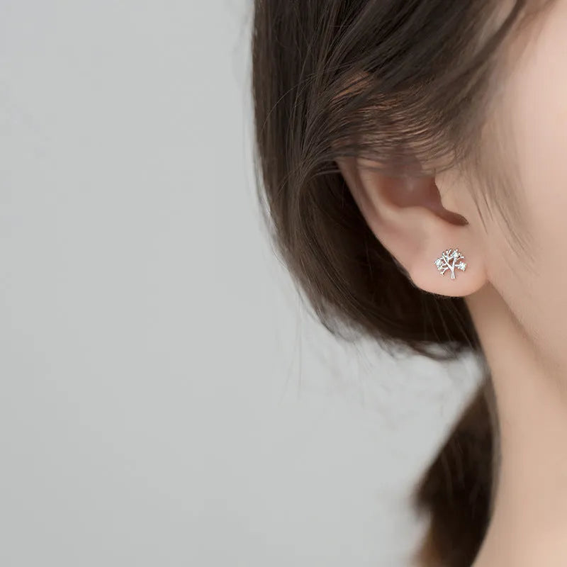 White gold coloured copper stud earrings with cute little tree design electroplated finish for women