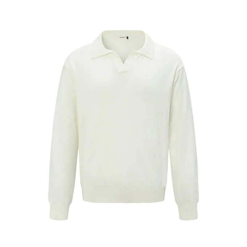 Man wearing a loose black pullover sweater for casual leisure wear.