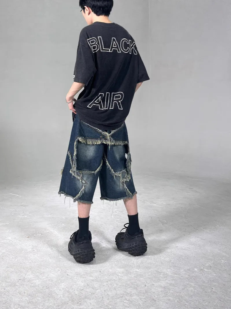 Blue retro denim shorts with frayed five-pointed star detail and loose fit design