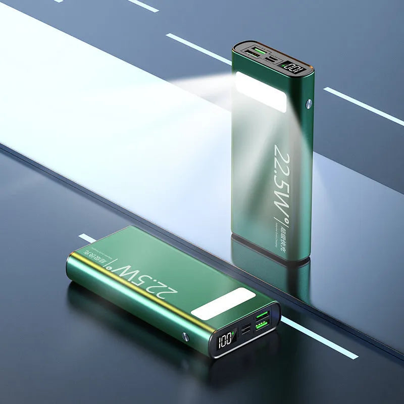 Black alloy 20000mAh power bank with LCD display showing battery level and USB ports.