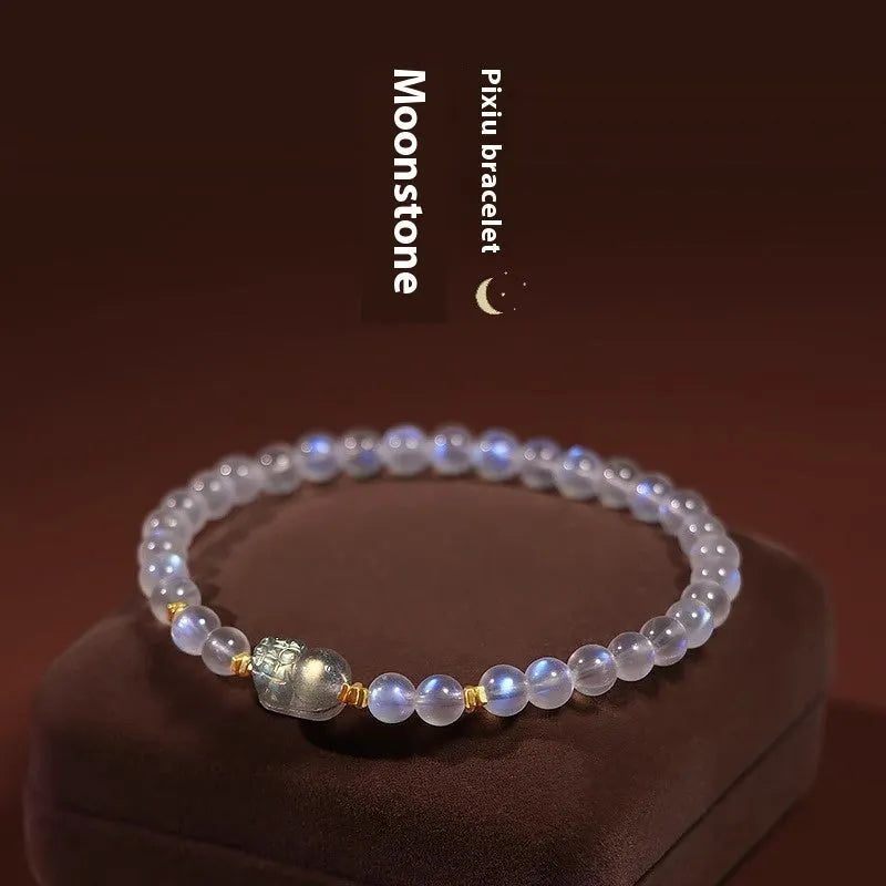 Polished moonstone bracelet with animal/Zodiac design on an adjustable cord for women.