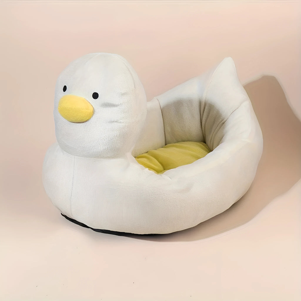 Blue duck-shaped fluffy pet bed for small dogs and cats on floor