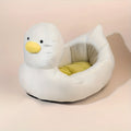 Blue duck-shaped fluffy pet bed for small dogs and cats on floor