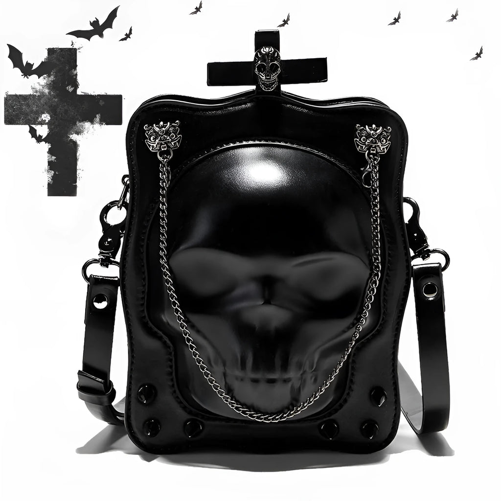 Black vertical square mini crossbody bag with embossed skull design, metal rivets, and chain strap.