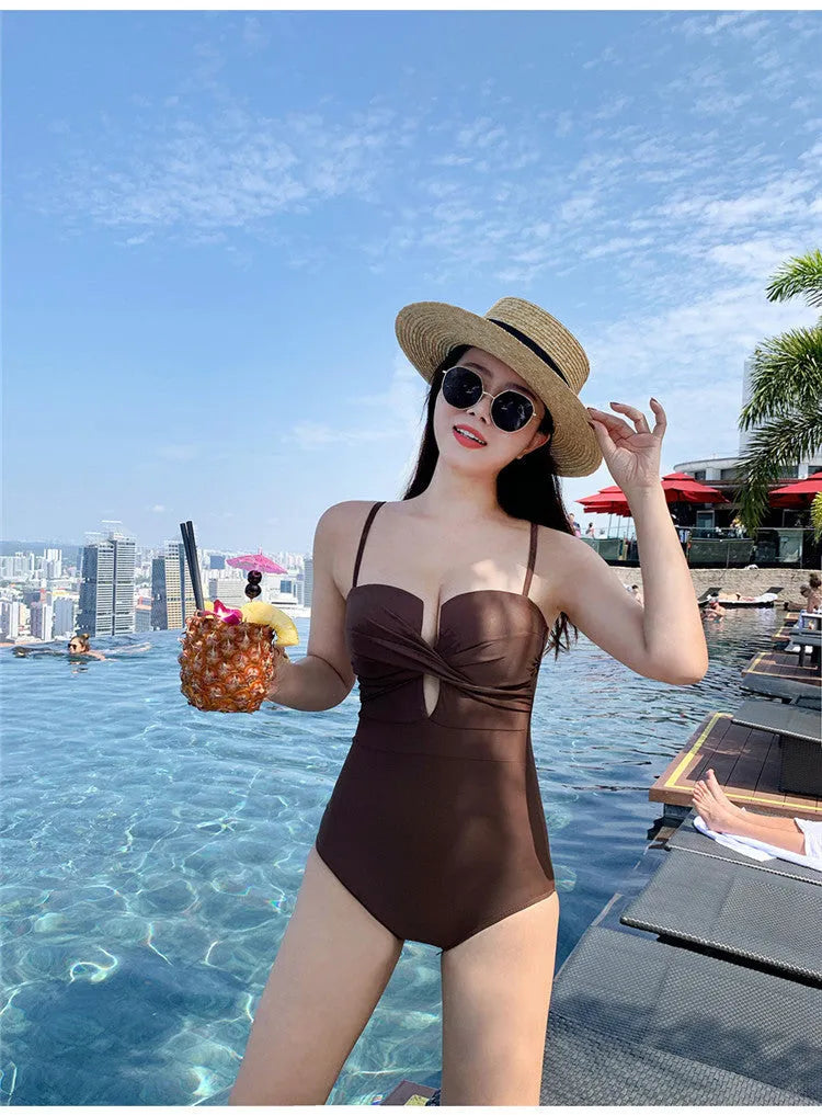 Women's solid colour one-piece swimsuit with push-up padding and spaghetti straps