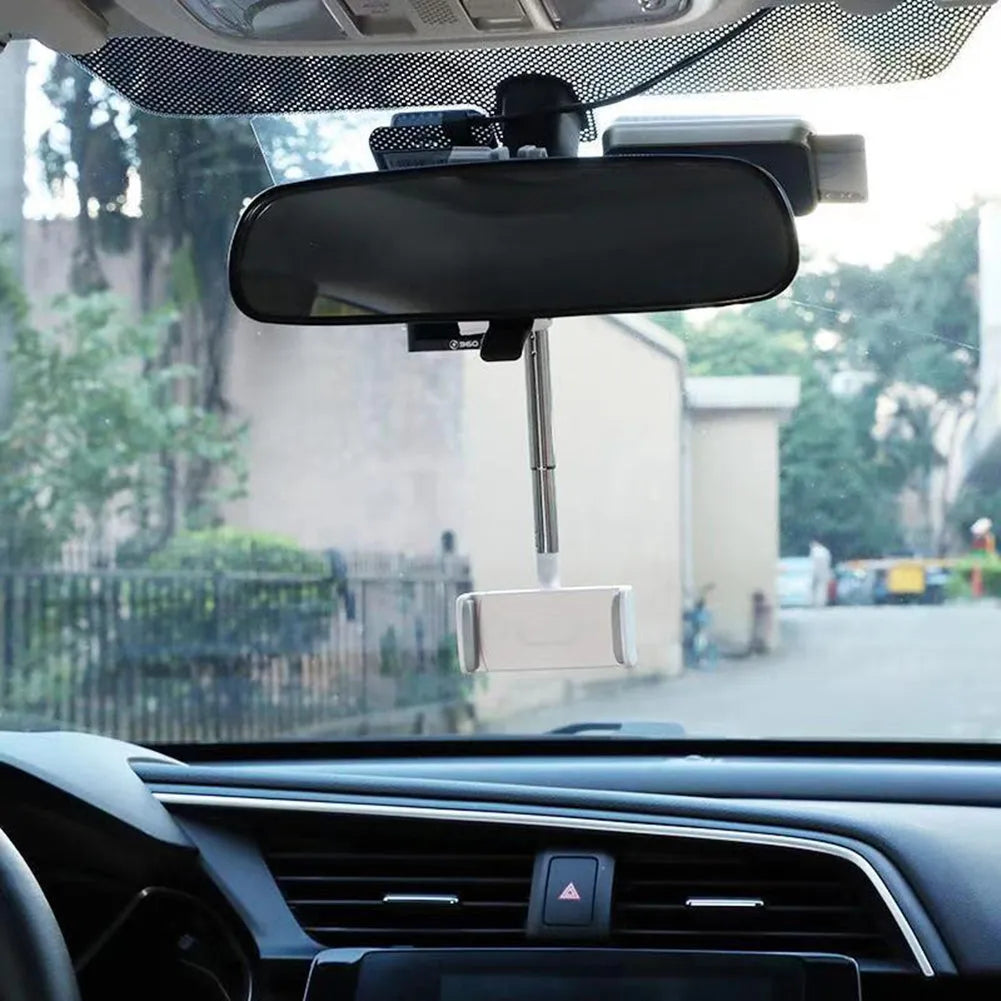 Black car phone holder mounted on rearview mirror showing 360-degree rotation mechanism