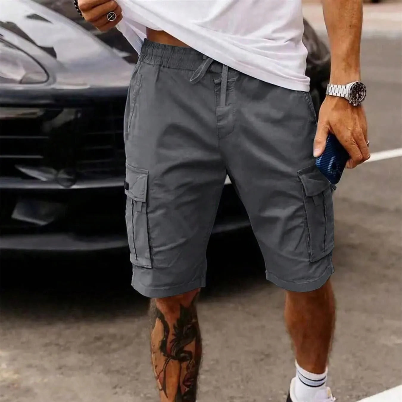 Men's straight-leg cropped workwear shorts in army green, showcasing loose fit and summer casual style.