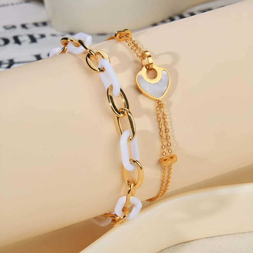 Women's stainless steel resin bracelet with a double-layer heart shape design.
