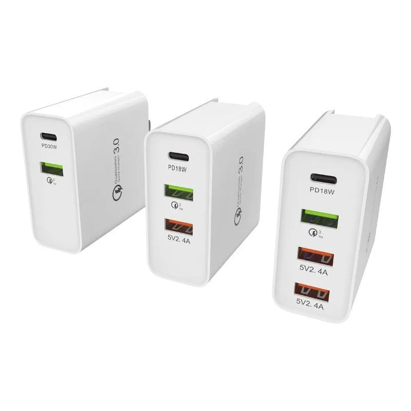 White multi-port USB fast charger with PD QC support on a table.