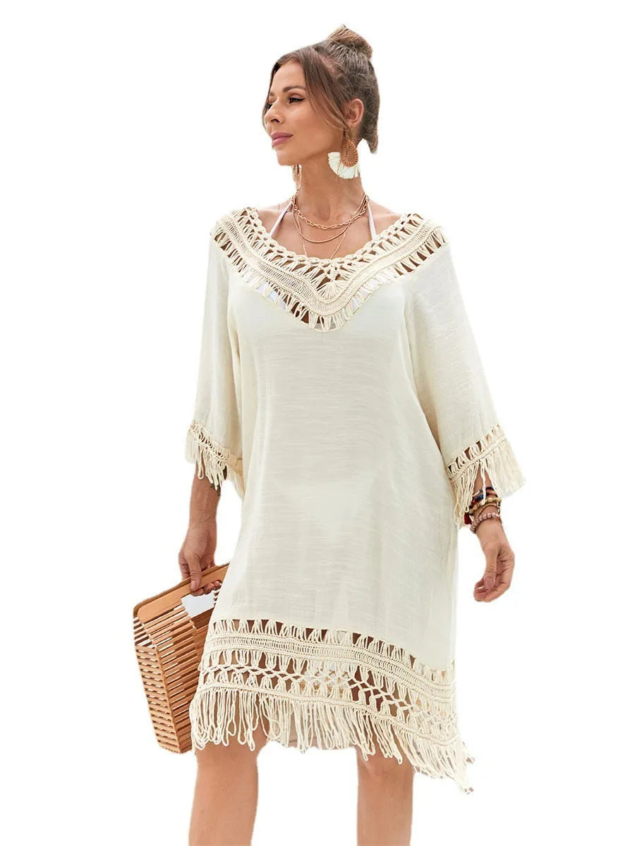 Apricot hand-crocheted beach dress with openwork pattern and lining, shown as swimsuit cover-up