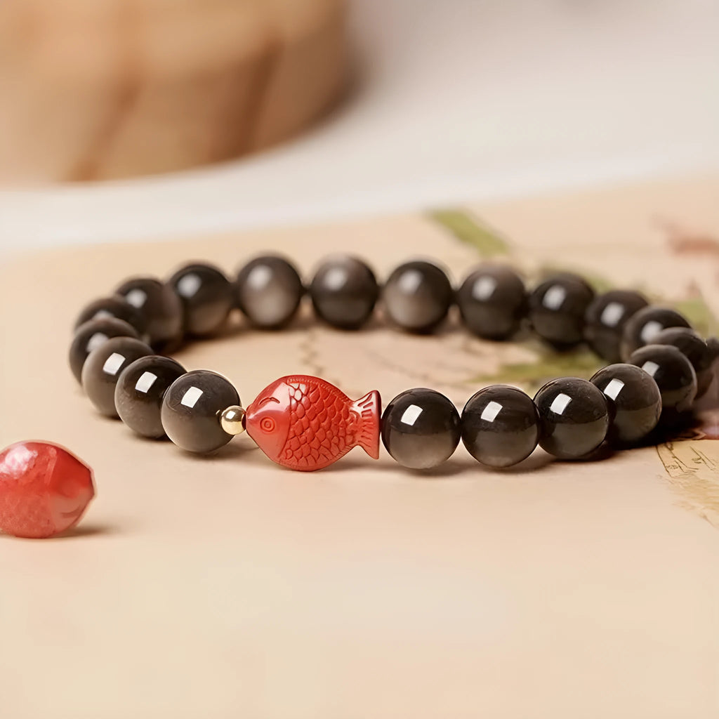 Natural obsidian and cinnabar round bead bracelet shown in three size options.