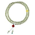 Pale blue Hetian jade bracelet with three circles of 6mm beads on a wrist.