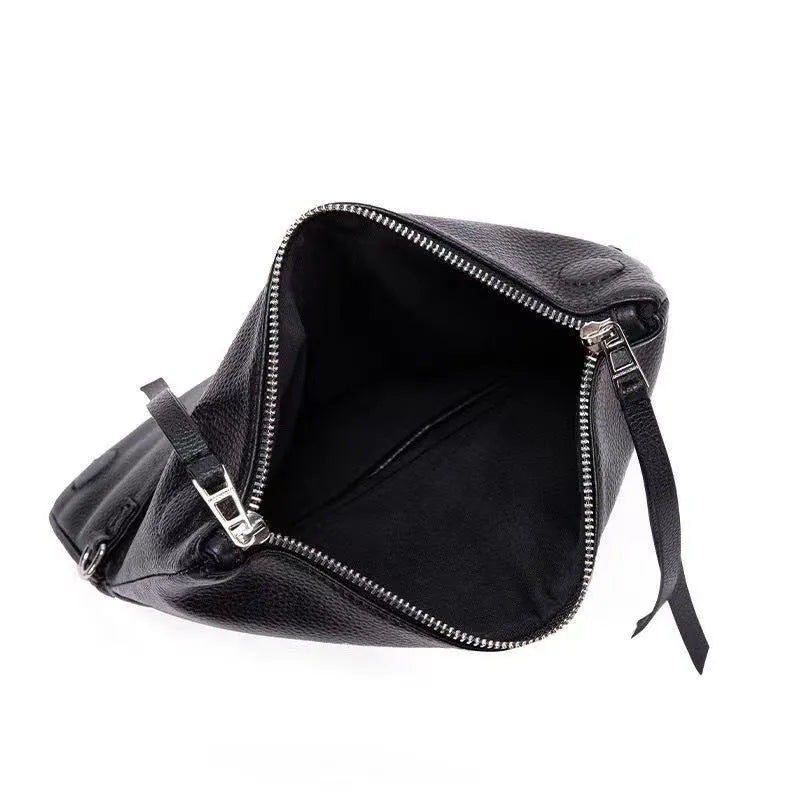 Women's black chain clutch bag with detachable shoulder strap showing interior zipper pocket and gold hardware details