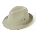 A classic brown fedora hat with a pinched crown and medium brim on a wooden table, showing its structured silhouette.