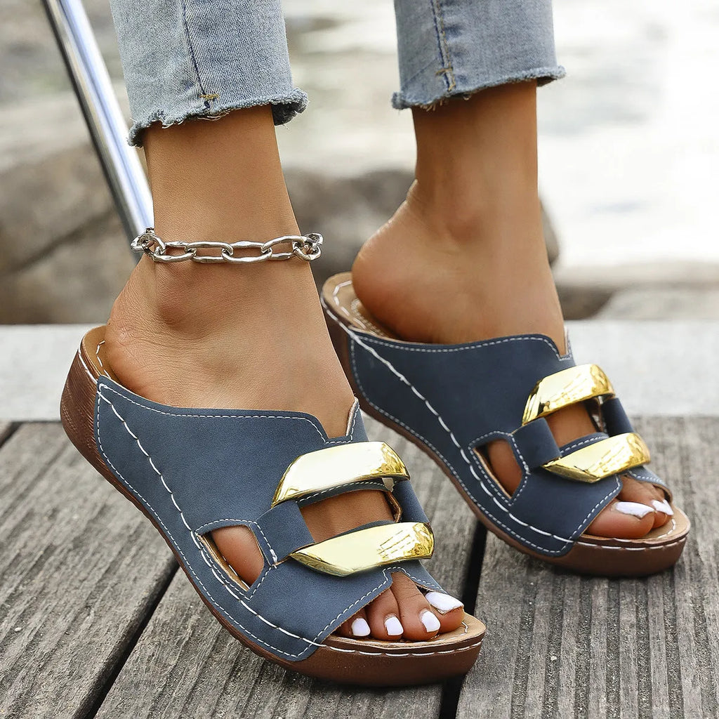 Women's Roman-style platform sandals in white, black, khaki, and sea blue with metal accent on rubber sole.