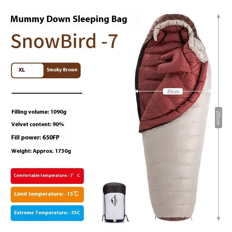 Goose down mummy sleeping bag in a stuff sack, part of the snowbird range for camping.