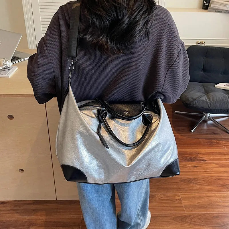 Black women's hand-carry travel bag with 36-55 litre capacity for short trips