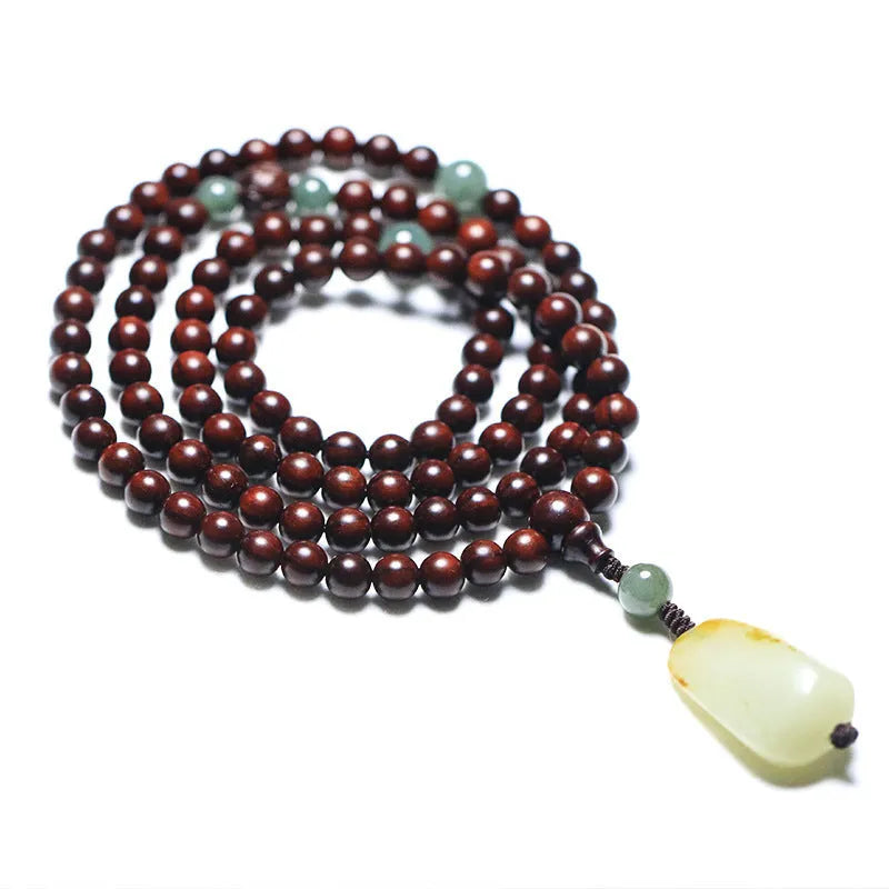 Traditional rosewood prayer bracelet with 108 beads, carved Pterocarpus santalinus decoration, and Hotian jade pendant