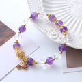 Purple crystal women's bracelet with micro-inlaid cherry blossom design in amethyst colour tones.