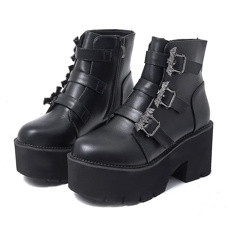 Black women's punk gothic Martin boots with bat buckle and side zip.