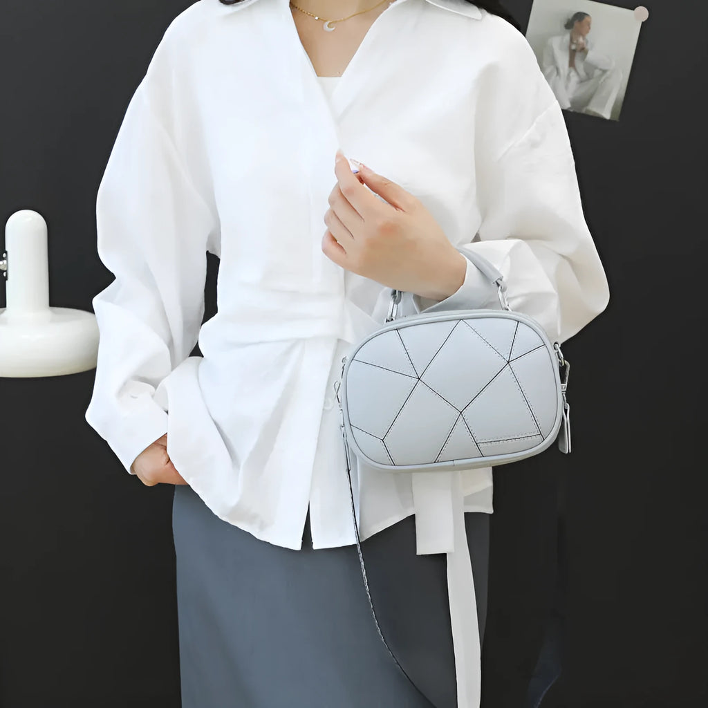 Three-layer retro patchwork small bag in round suitcase shape with stitching detail
